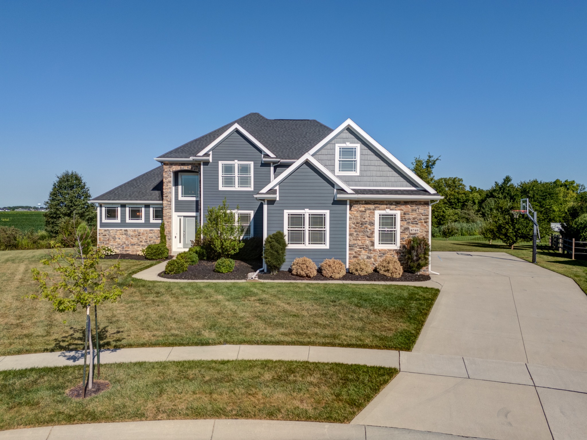 Straight-on view of the home and driveway