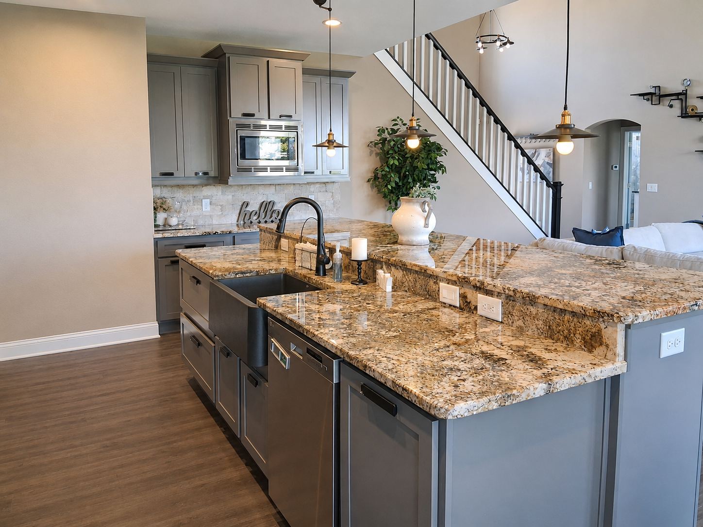 Kitchen island opening to the great room and staircase